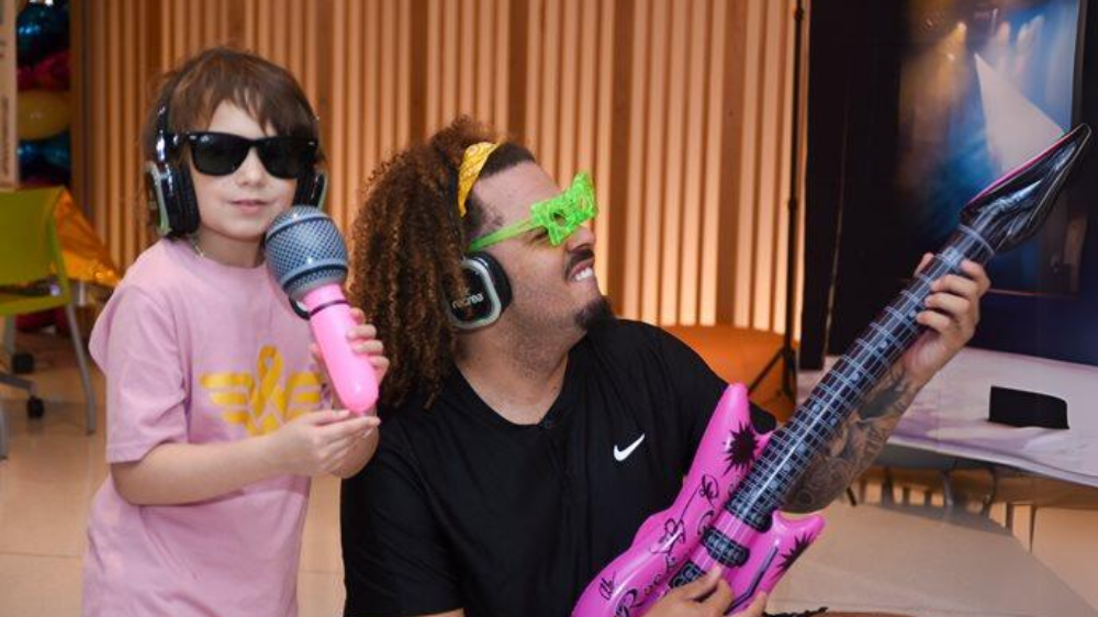 iHeart4Kids radiothon Volunteer with patient
