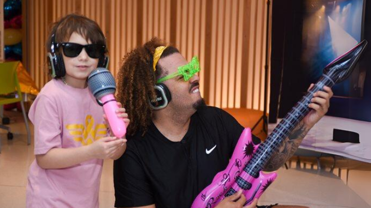 iHeart4Kids radiothon Volunteer with patient