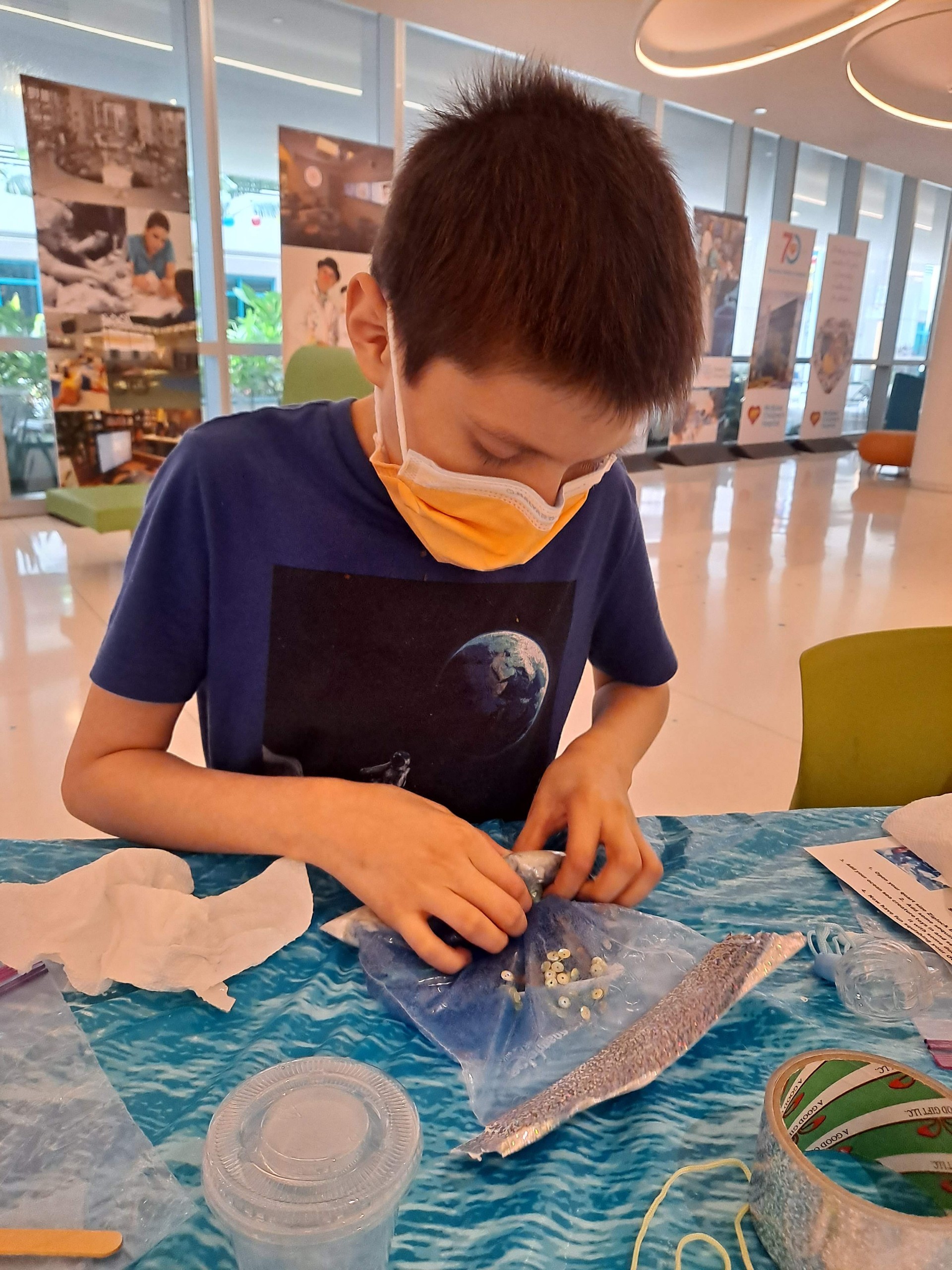 Axel at a table participating in an activity